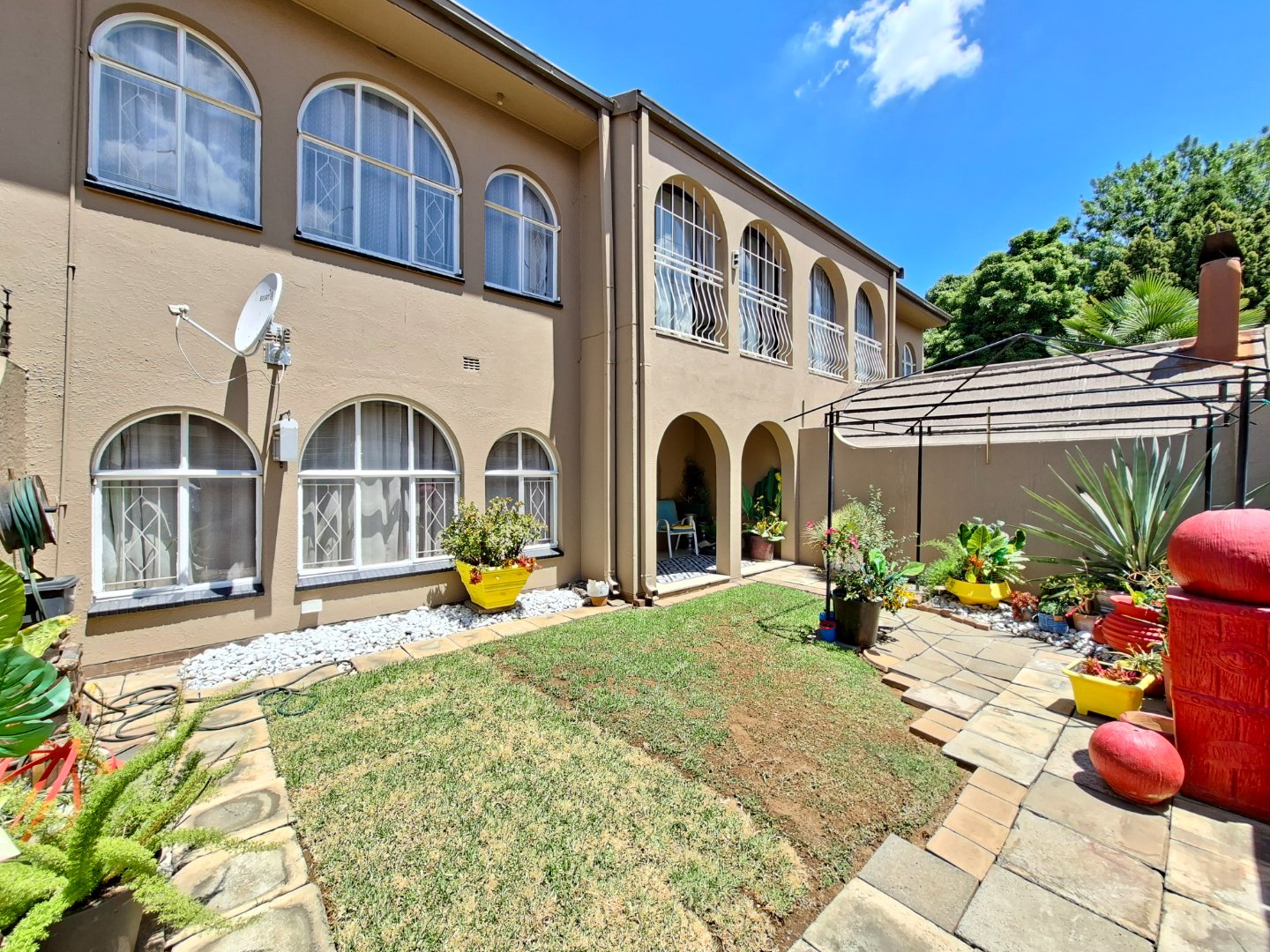 Stylish and Energy-Efficient Duplex Townhouse with Private Garden and Modern Comforts