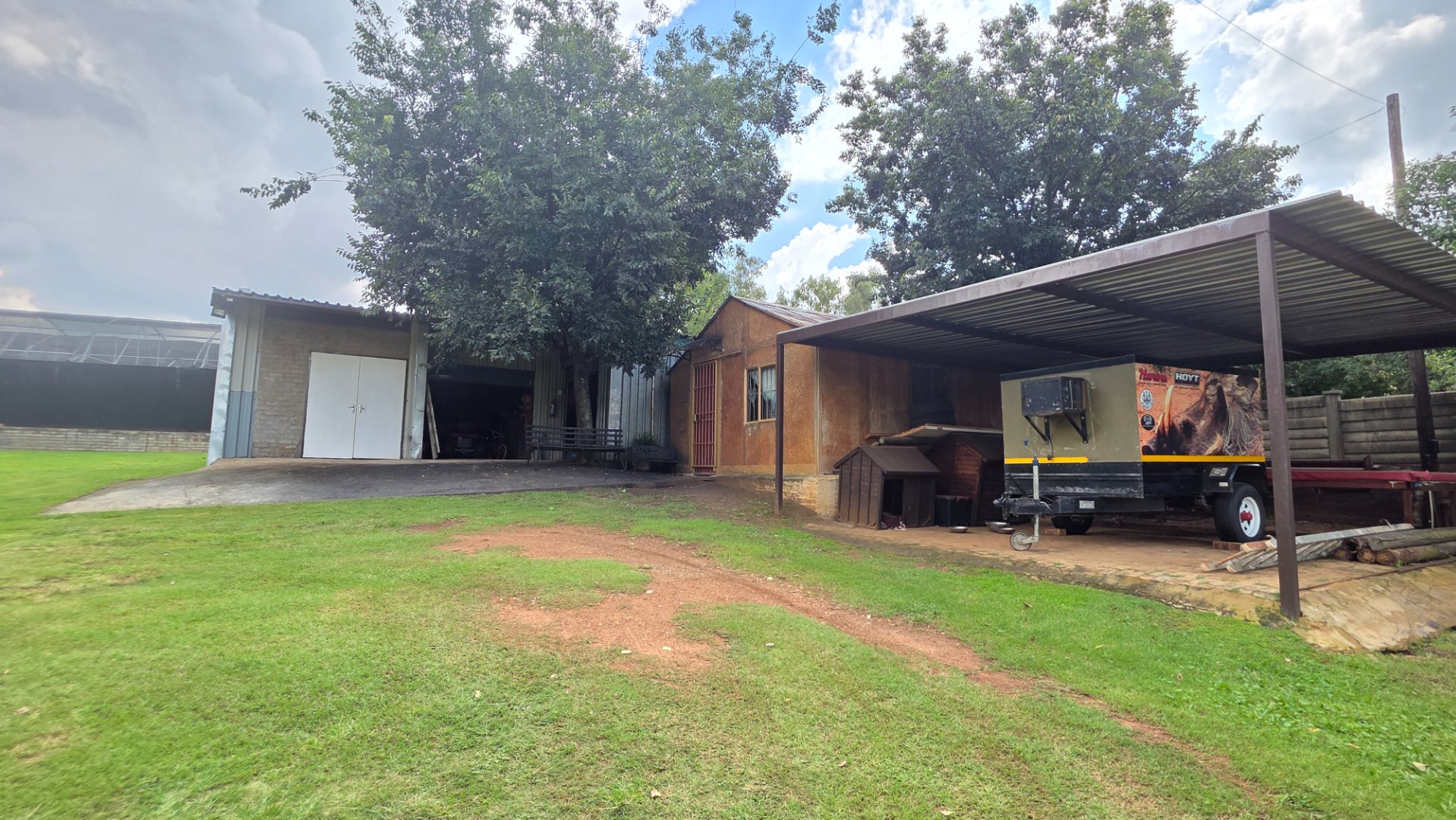 CARPORT AND STORE ROOMS