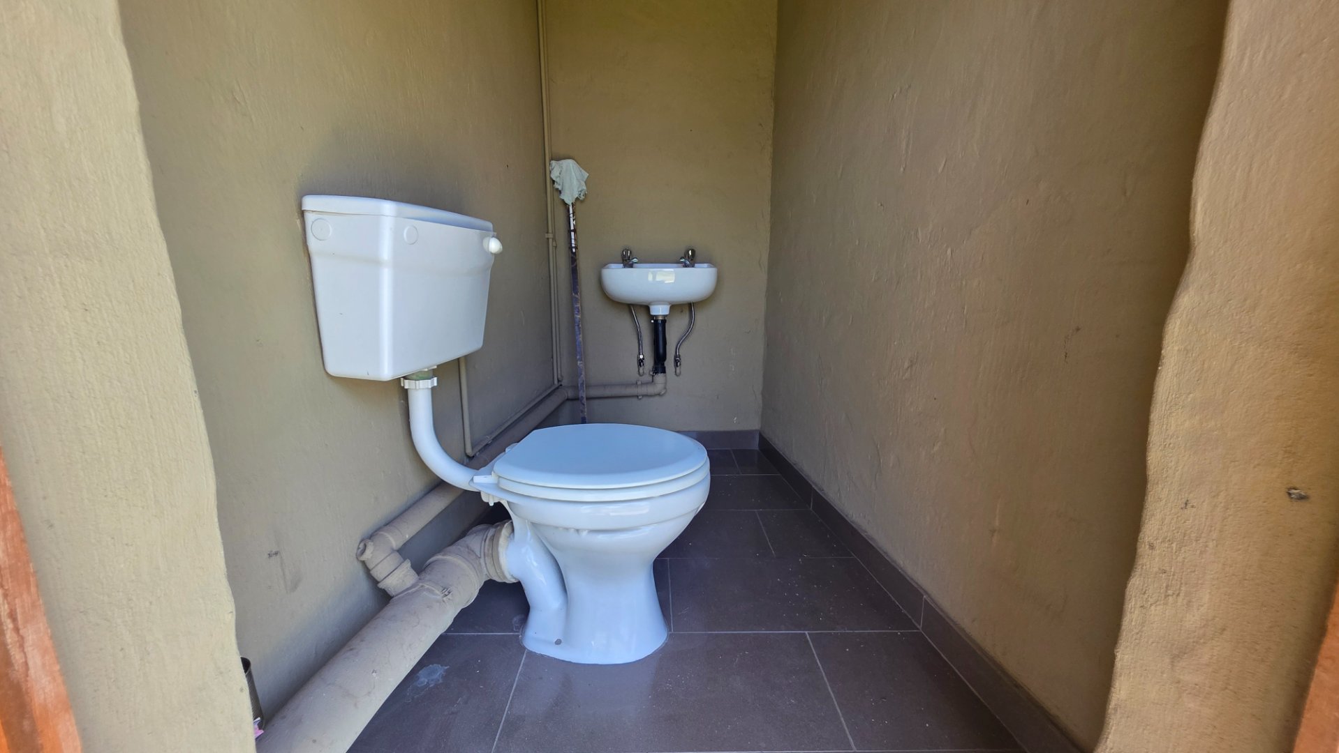 OUTSIDE TOILET AT SECOND DWELLING