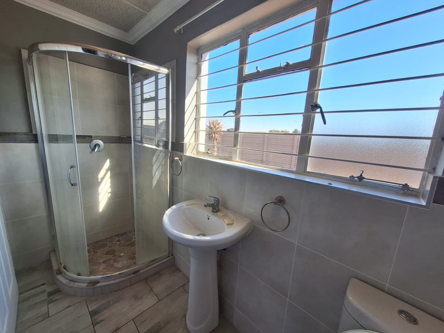 SHOWER IN BATHROOM OF FLAT