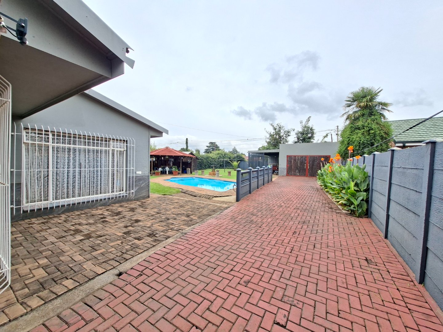 DRIVEWAY TO GARAGE AND BACK GARDEN
