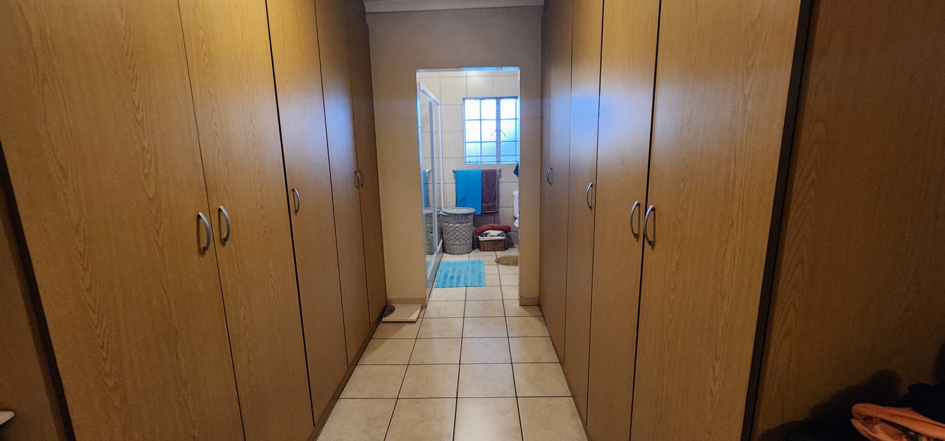 PASSAGE CUPBOARDS TO BATHROOM