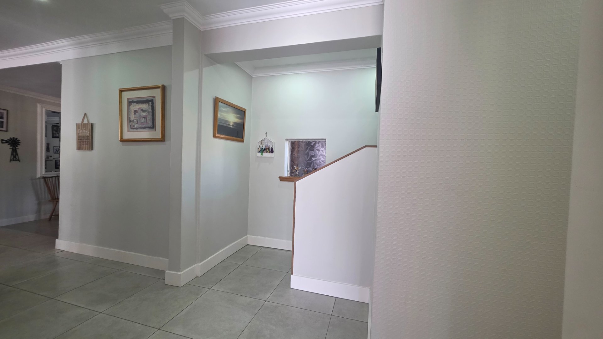 PASSAGE WITH STAIRCASE TO UPPER LEVEL