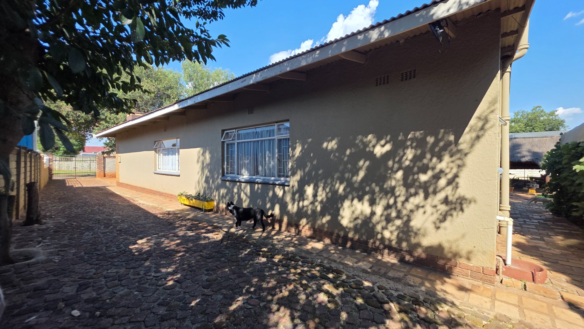 FAMILY DWELLING WITH TWO FLATS,MAKING THIS AN EXCELLENT INVESTMENT FOR EITHER A FAMILY OR DEVELOPER