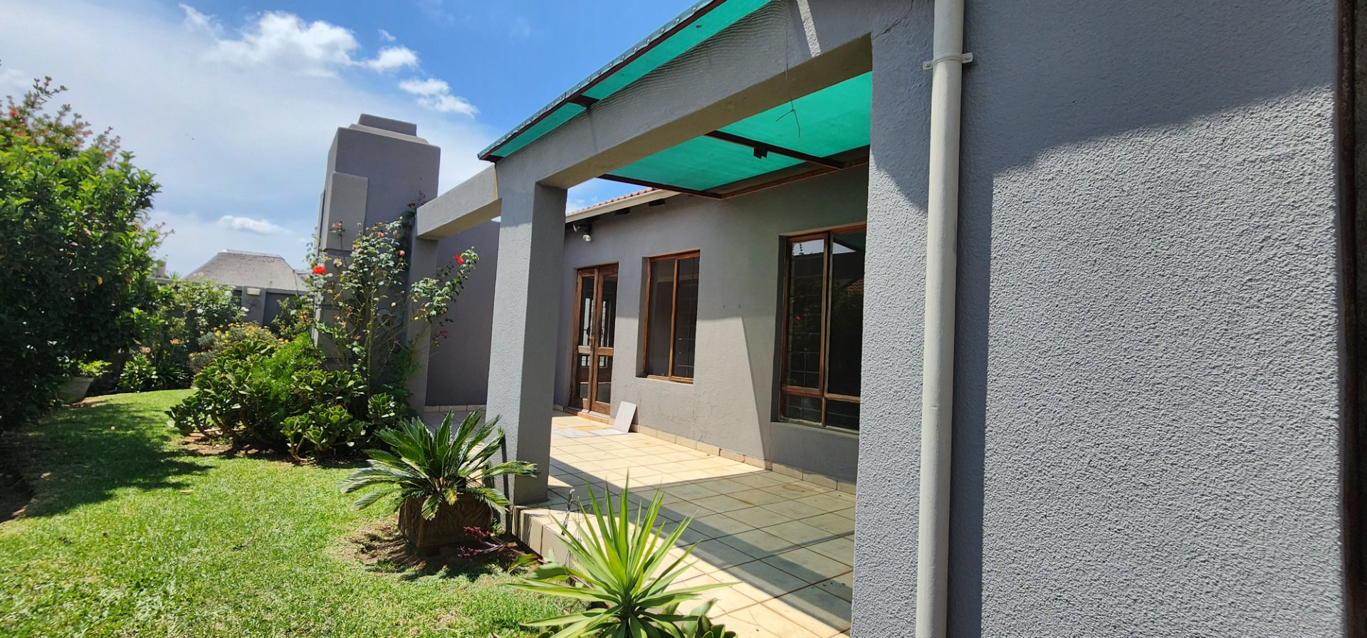 A  TUSCAN, MODERN STYLE TOWNHOUSE  IN A SECURE COMPLEX