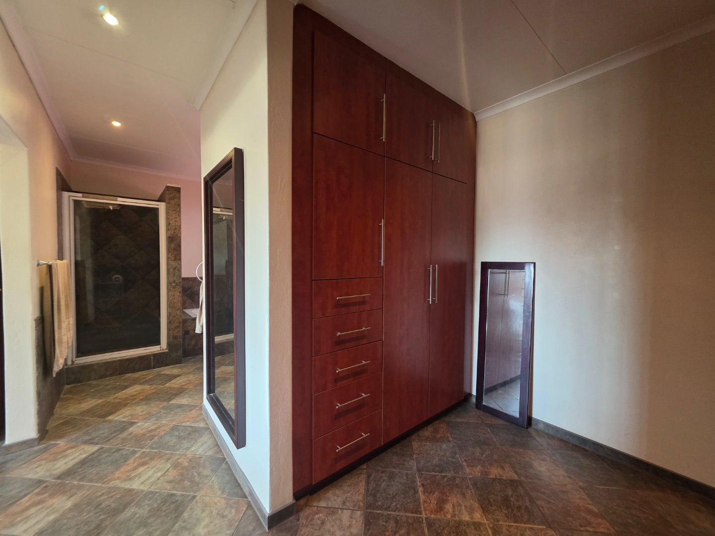 WALK IN CUPBOARD IN MAIN BEDROOM HOUSE 1