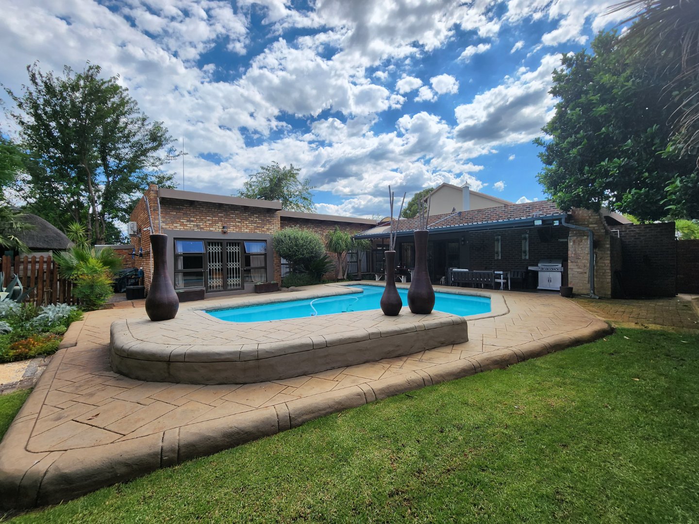 Exquisite Four-Bedroom Home with Pool, Energy-Efficient Features, and Premium Entertainment Spaces