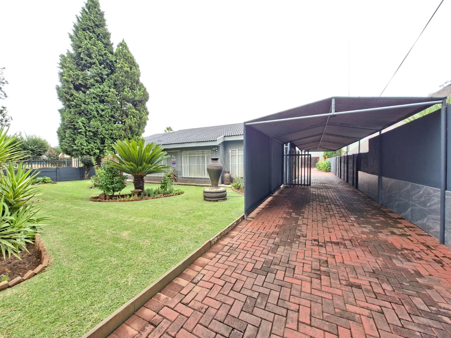 DRIVEWAY WITH CARPORT