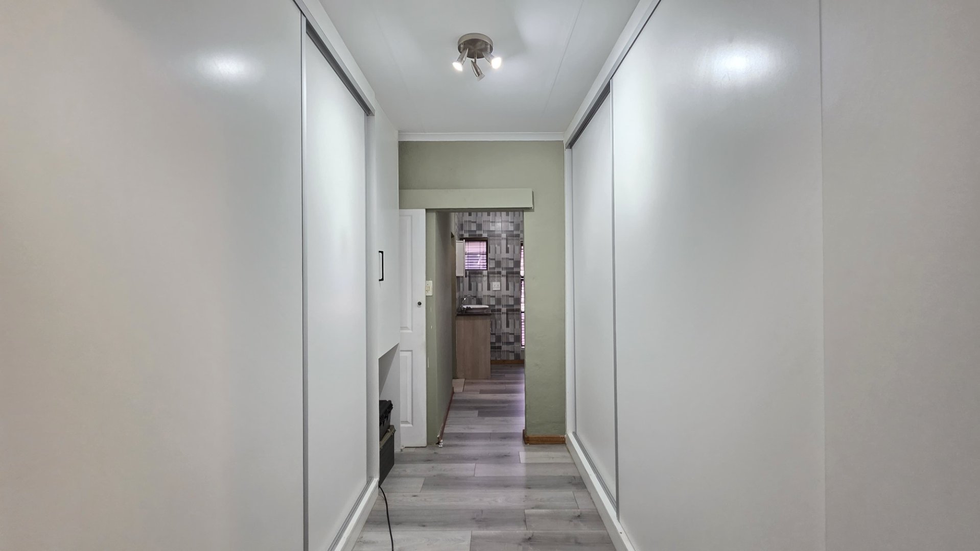 HALLWAY TO BEDROOM AREA