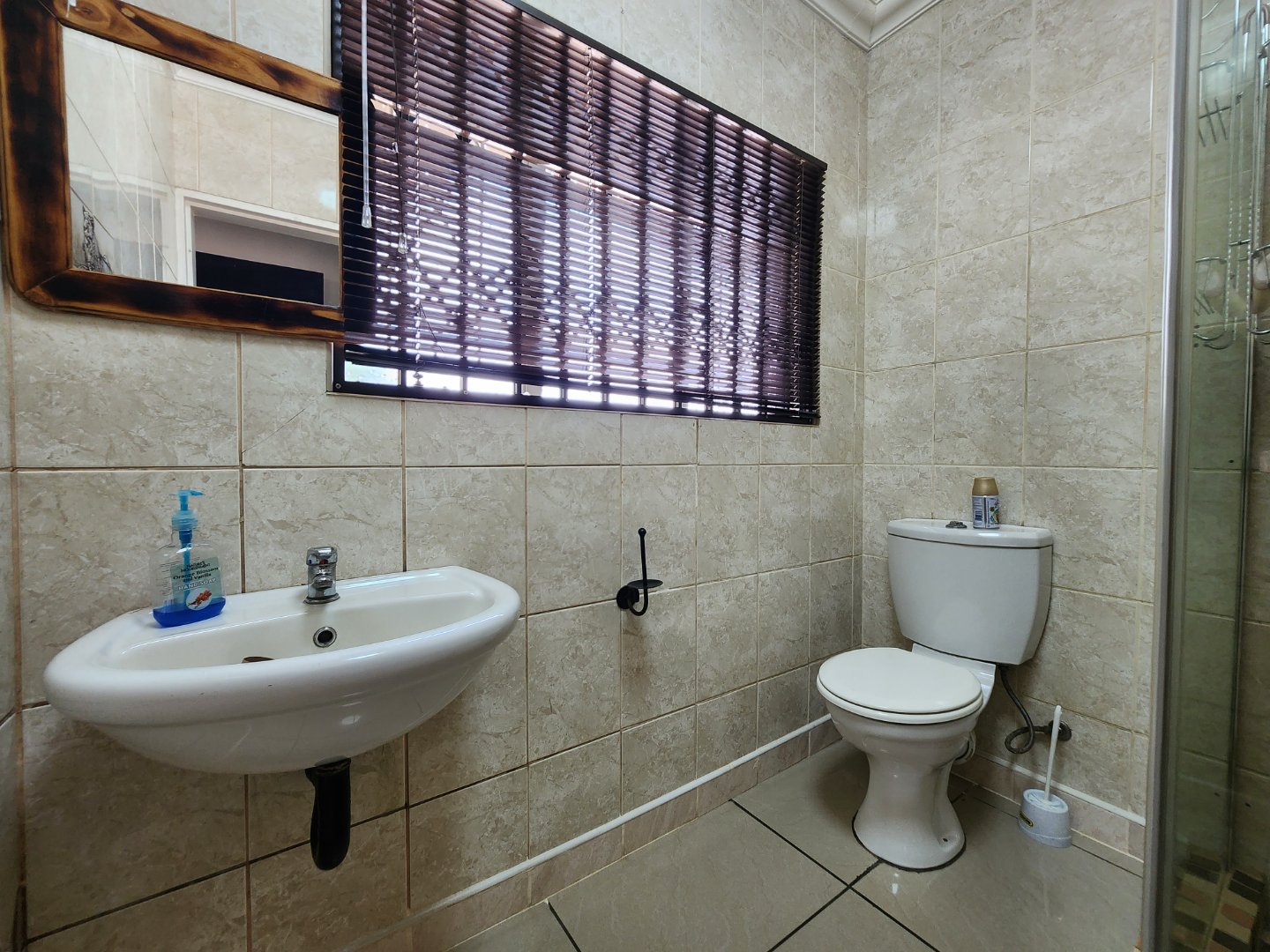 BASIN AND TOILET IN BATHROOM 3